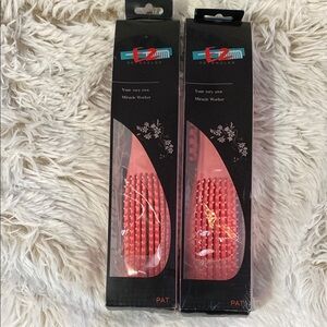 Pink detangling hair brushes.
